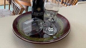 A bottle of Rosso Dolce Sweet Red wine on a table with two glasses. - Magical Family Oasis - Diamond Sunsets in Vacation Land -Sleeps10 -Pet Friendly  (Punta Gorda)