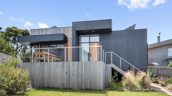 A modern house with a wooden deck, a staircase, and a large window. - Stage 1 - Point Lonsdale (Point Lonsdale)