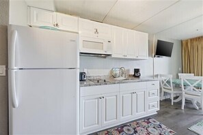Fridge, microwave, stovetop, coffee/tea maker