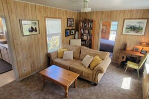 TV, fireplace, books - 4 guest · Eddie Bauer's former Beachfront Cottage (Sekiu)