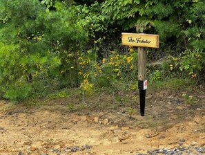 Discover The Foxhole, a secluded retreat nestled among lush greenery.