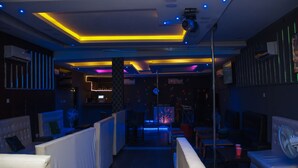 A modern lounge area with seating and a bar. - Go2Hotel45 (Lagos)