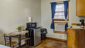 Fridge, microwave, coffee/tea maker, cookware/dishes/utensils