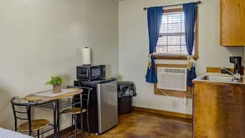 Fridge, microwave, coffee/tea maker, cookware/dishes/utensils