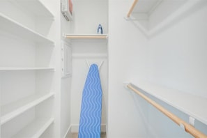 Closet in the primary bedroom. - New! Cozy and Elegant Townhome- 2 miles from Downtown (Houston)