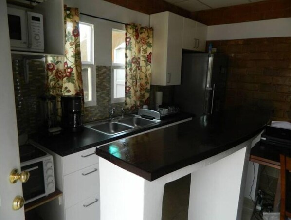 Fridge, microwave, cookware/dishes/utensils