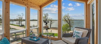 Cozy, year-round lake home with magnificent sunset views, lake access and dock.