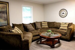 Living area - Room for 10 and unlimited hot water!! (Cary)