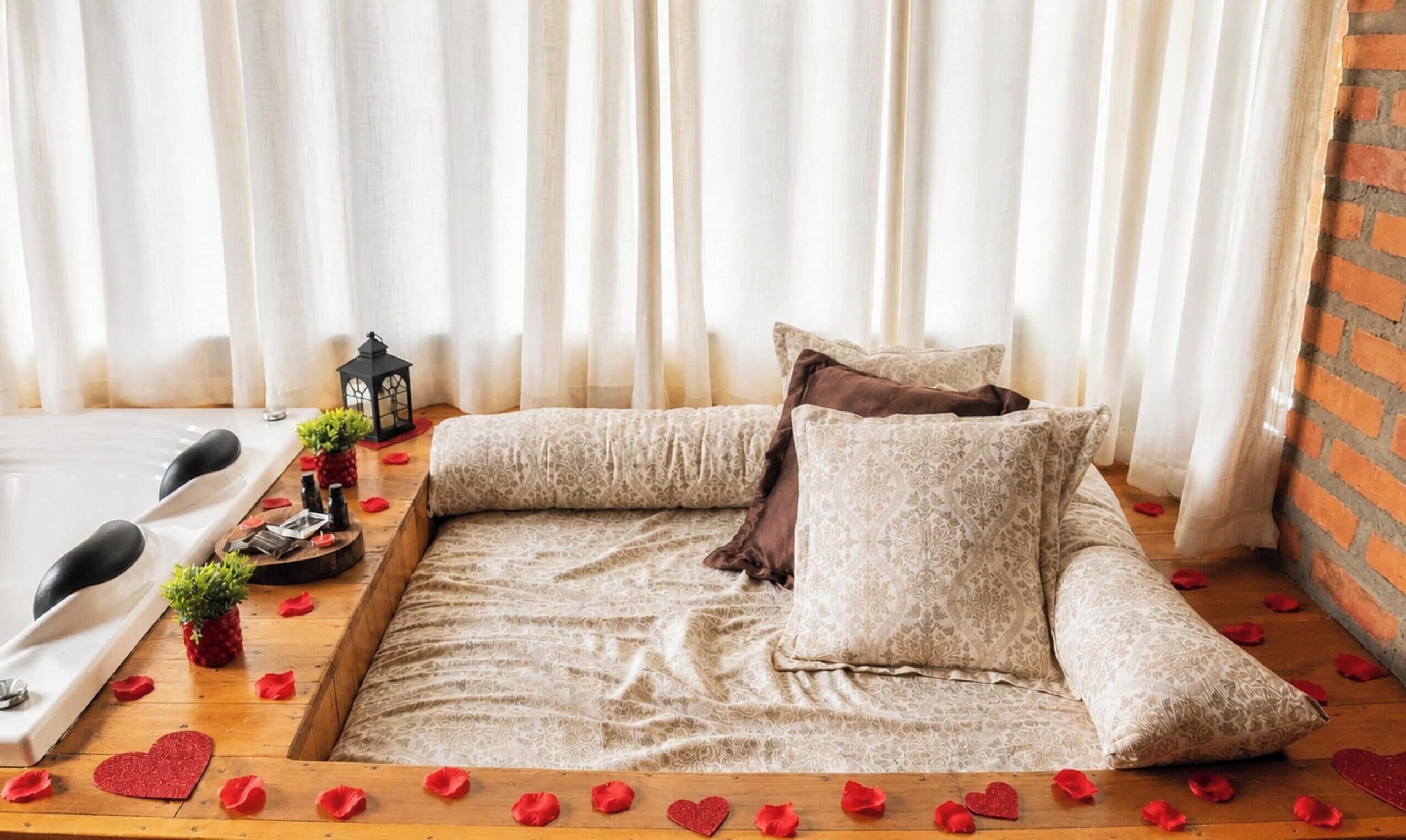 A cozy room with a sofa, a small table with a candle, and a decorative lantern.