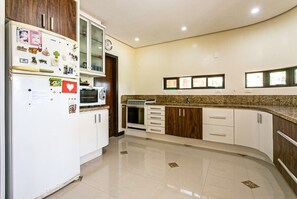 Honeymoon House, Jetted Tub, Lake View | Private kitchen | Fridge, dining tables