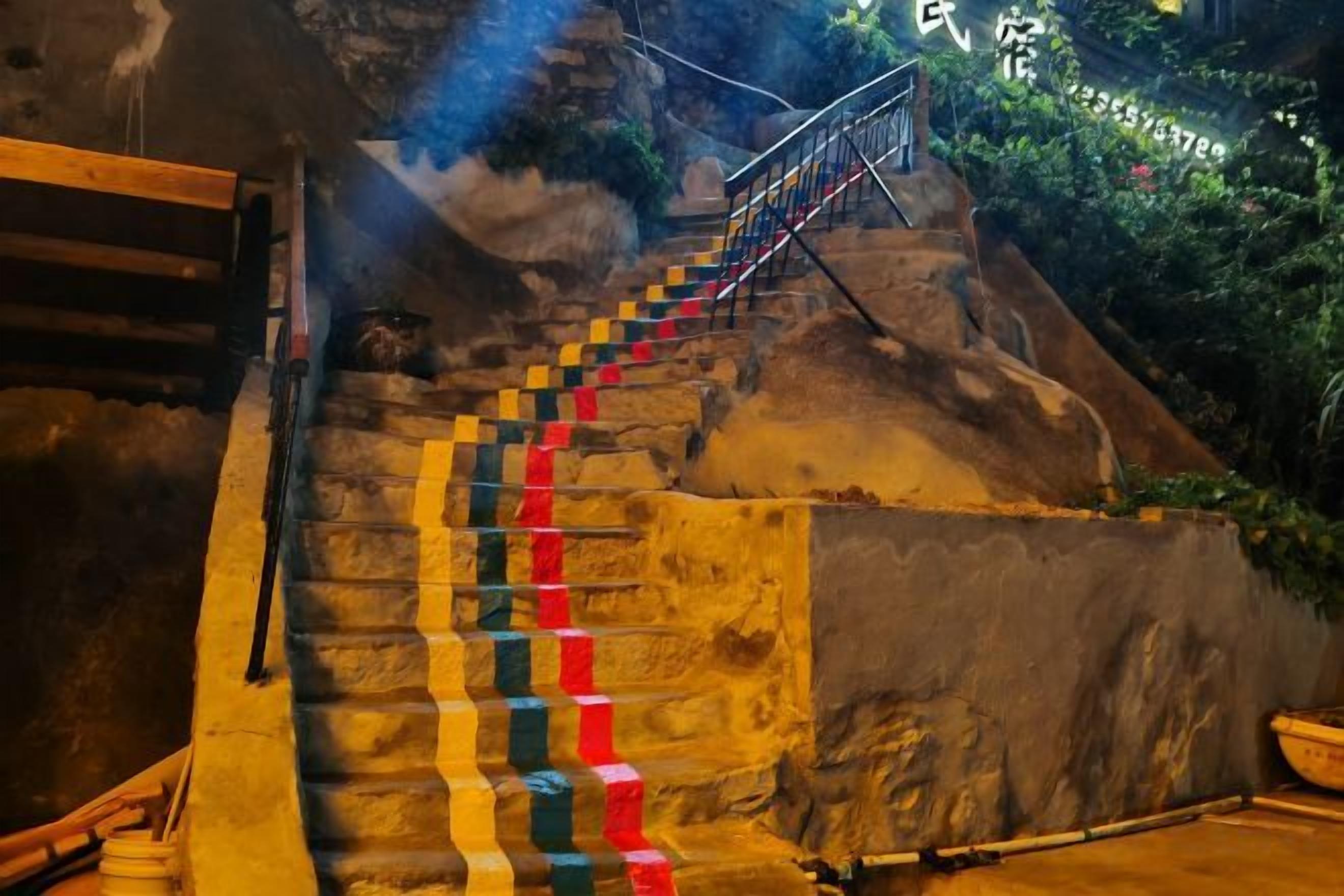 A staircase with colorful steps leading up to a platform.