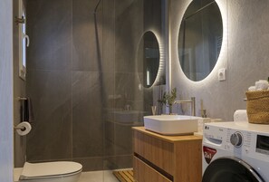 Shower, hair dryer, towels, soap