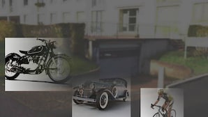 A building with a garage, a motorcycle, a vintage car, and a cyclist. - For a pleasant break in the Park! (Alençon)