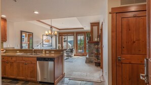 A spacious kitchen with a central island, wooden cabinets, and a built-in dishwasher. - ⭐ GUEST FAVORITE — BOOK ASAP! ⭐ (Truckee)