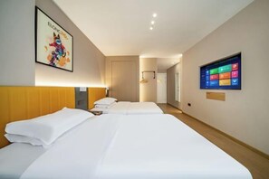 A hotel room with two beds, a TV on the wall, and a poster on the wall. - Yixuan Hotel (Ningbo Xiangshan People's Square) (Xiangshan)