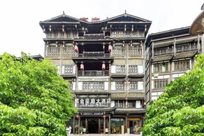 A traditional multi-story building with balconies and a sign indicating it is a hotel. - Zijin Haoting Hotel (Renhuai)