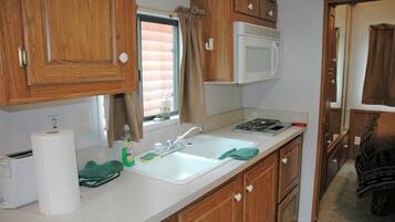 Fridge, microwave, stovetop, coffee/tea maker