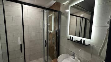 Economy Double or Twin Room | Bathroom | Designer toiletries, hair dryer, slippers, towels