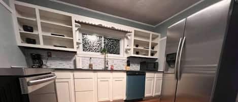 Fridge, microwave, stovetop, cookware/dishes/utensils