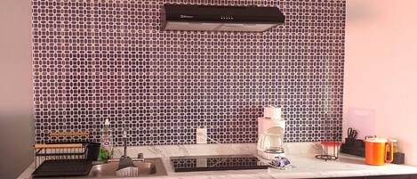 Fridge, microwave, coffee/tea maker, cookware/dishes/utensils