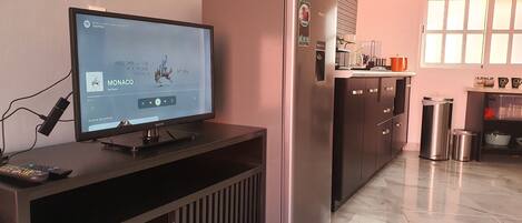 Fridge, microwave, coffee/tea maker, cookware/dishes/utensils