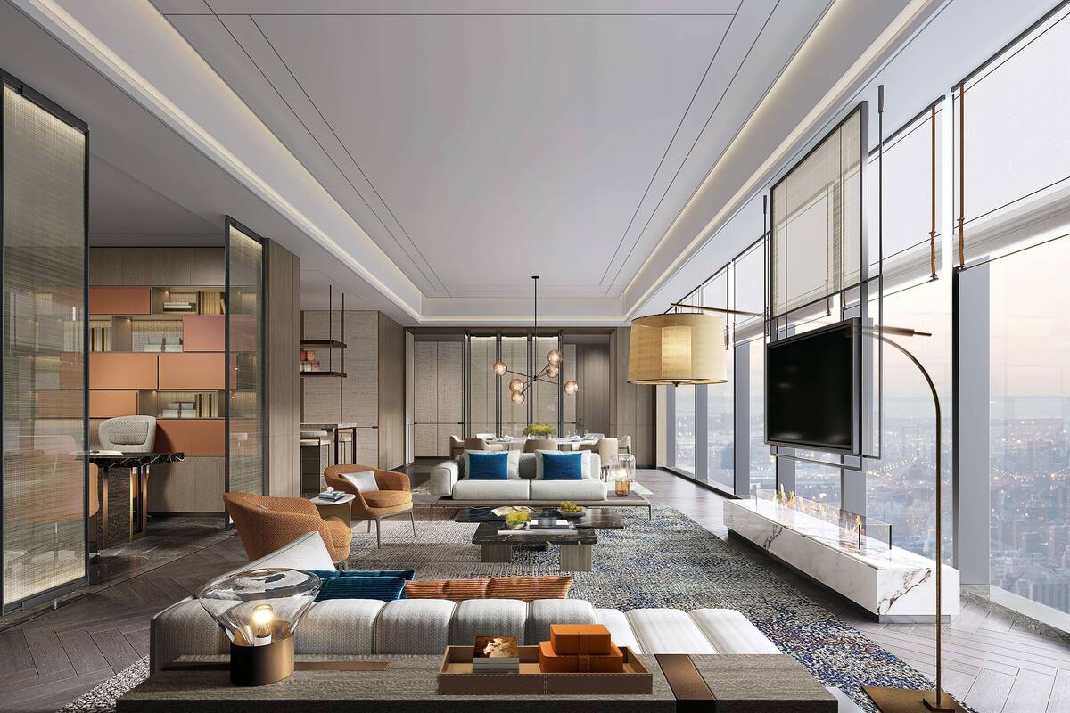 A modern living room with a large TV, comfortable seating, and a city view.