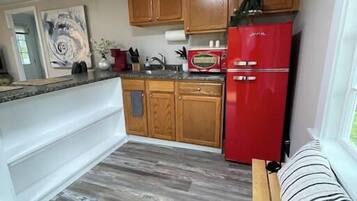 Fridge, microwave, stovetop, coffee/tea maker