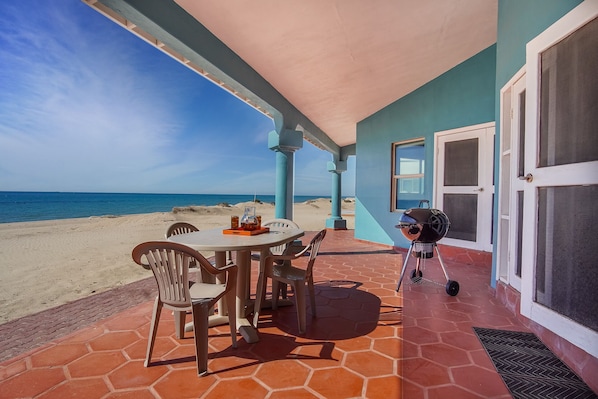 Enjoy a meal on the patio with a view of the beach, where you can grill and dine in comfort.