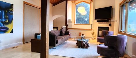 Exclusive House | Living area | 65-inch flat-screen TV with cable channels, TV, fireplace