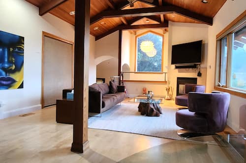 Exclusive House | Living area | 65-inch flat-screen TV with cable channels, TV, fireplace