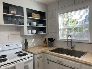 Fridge, microwave, oven, stovetop - Quaint 2 Bedroom Flat Downtown (Cloverdale)