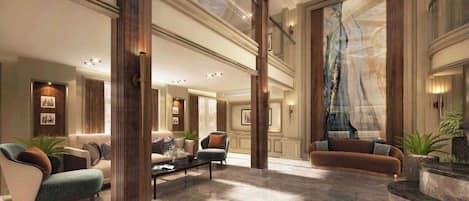 A spacious lobby with high ceilings, a grand staircase, and a large wall mural.