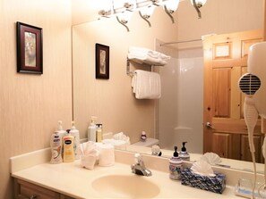 Shower, hair dryer, towels, soap