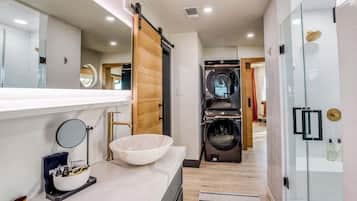Combined shower/bathtub, hair dryer, towels, soap