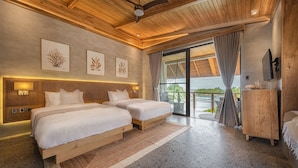 A spacious bedroom with two beds, a ceiling fan, and a large window with curtains. - Manami Resort (Sipalay)