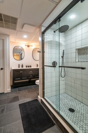 Shower, hair dryer, towels, toilet paper