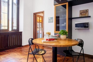 Dining - GuestHost - Spacious two-room apartment with kitchen for 5 persons with one bedroom, living room with sofa bed and a loft (overlooking the rooms below) with a bed and office area. The kitchen/dining room is separate. In total 65 sqm in old Milan building (Milan)