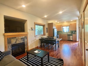 Townhome | Living area | 50-inch flat-screen TV with satellite channels, TV, fireplace