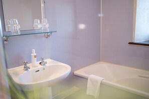 Bathtub, hair dryer, towels