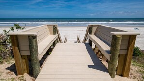 A wooden boardwalk leading to a beach with a clear view of the ocean. - New Flooring, Kitchen, & Bath! Beachfront, Direct Ocean & Pool Views, Elevator, $300 in Free Tickets (St. Augustine)