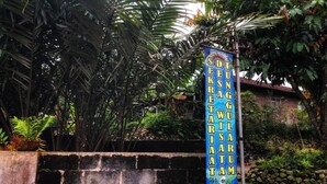 A sign with text in a non-English language, mounted on a metal pole. - Hotel O Desa Wisata Tunggul ArumNearWisata Tunggularum (Kaliurang)