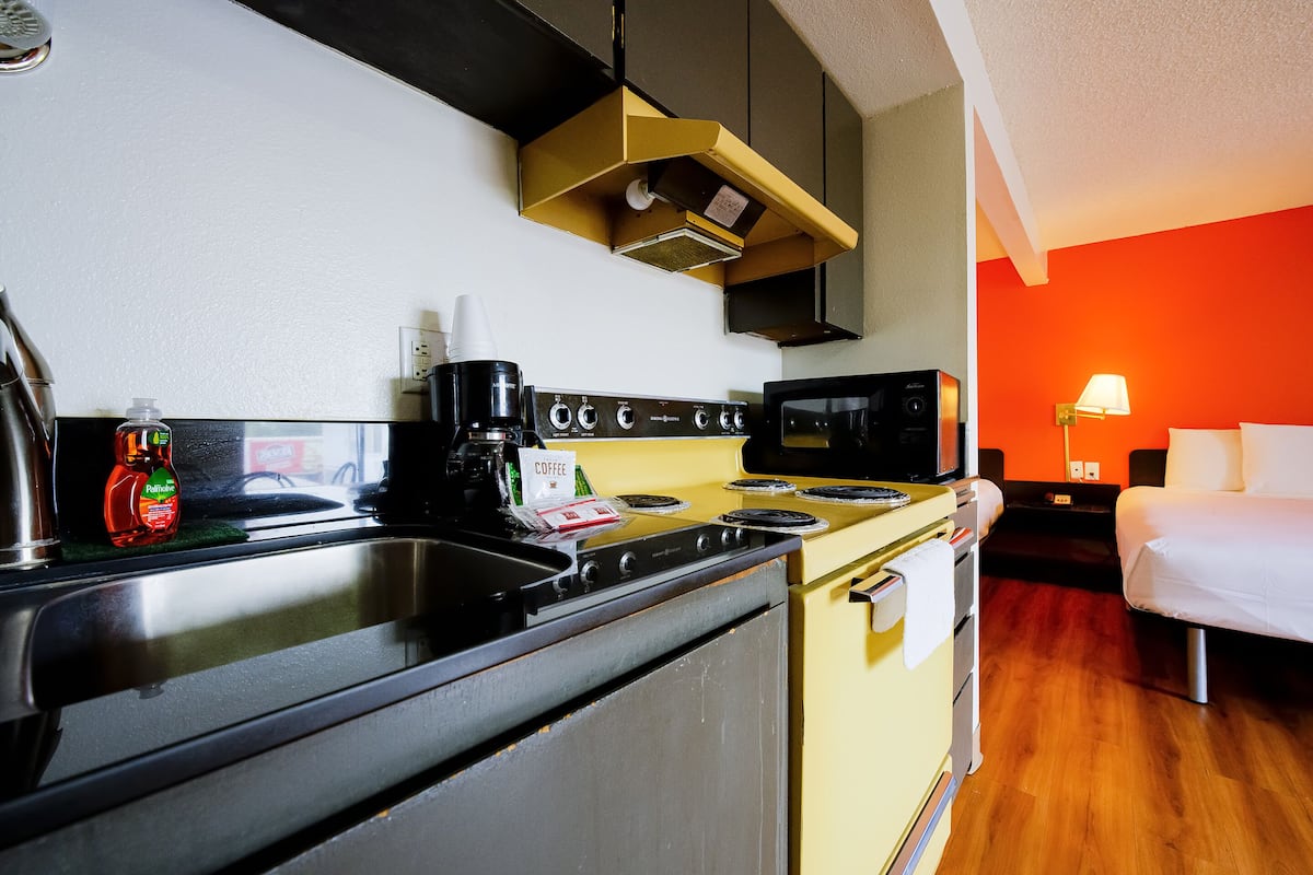 desk, iron/ironing board, alarm clocks