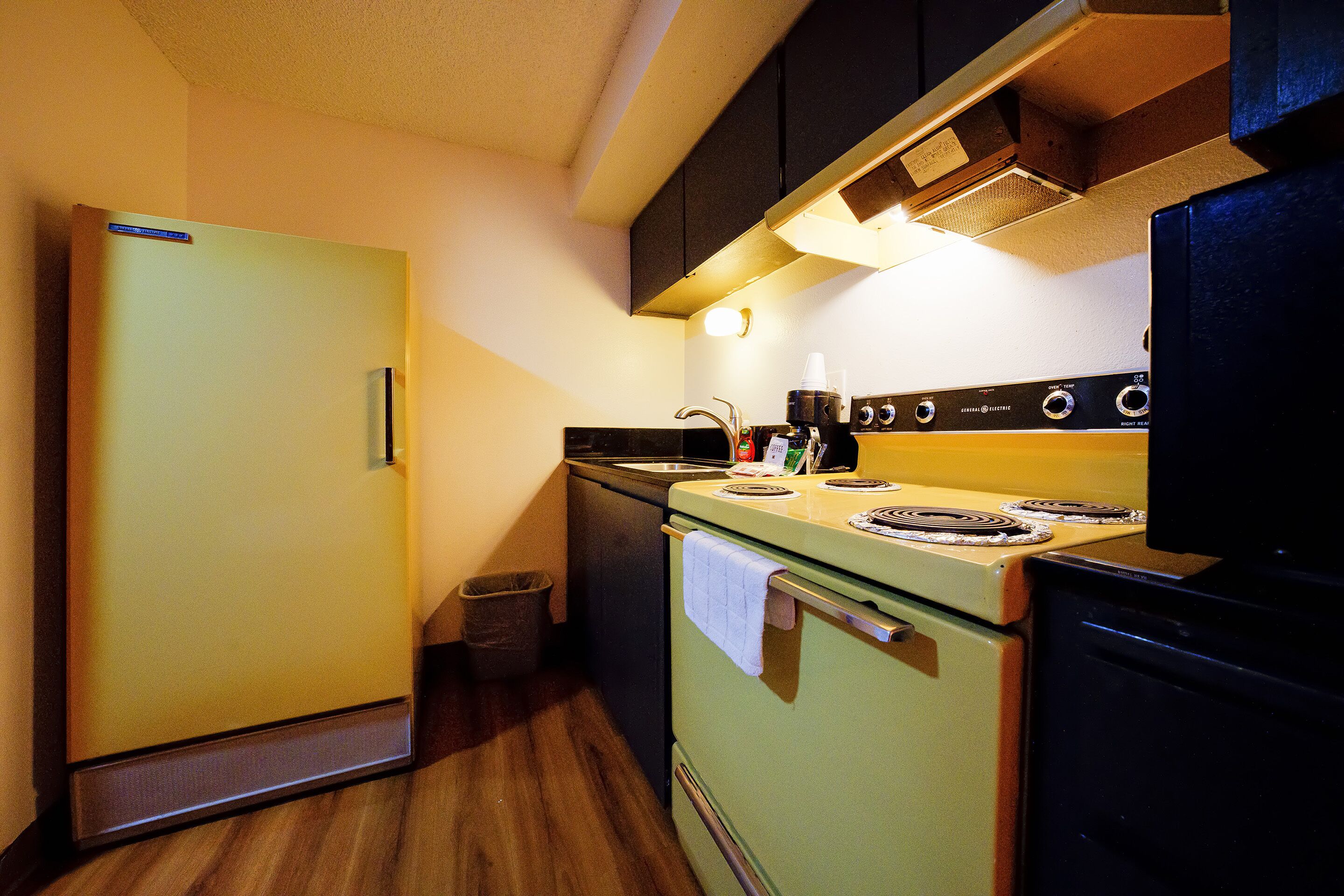 desk, iron/ironing board, alarm clocks