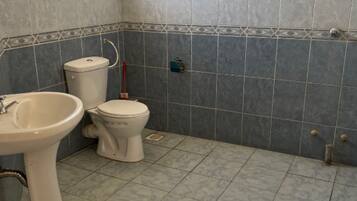 Shower, slippers, towels, soap