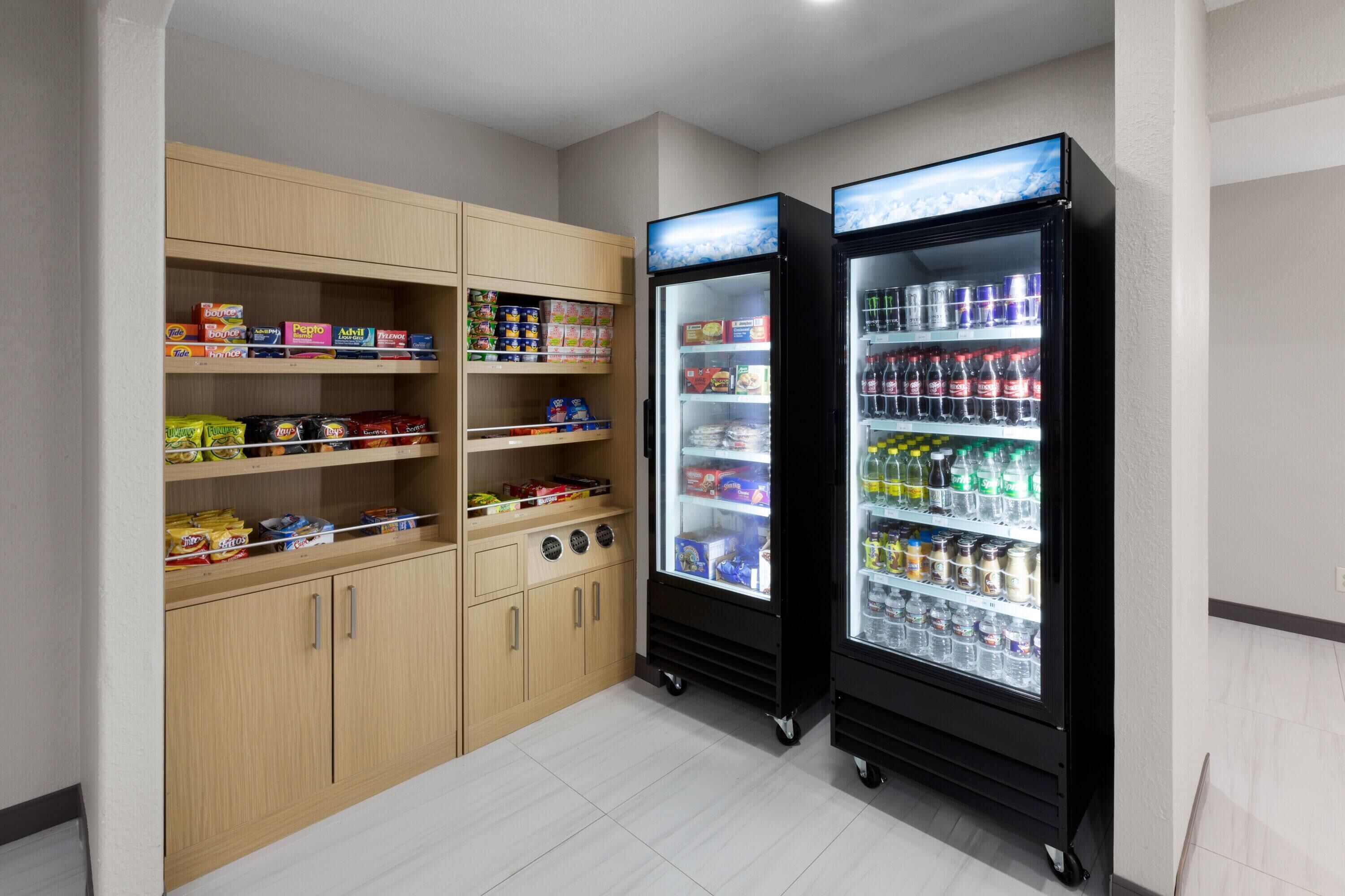 A vending machine area with snack and drink options, including chips, candy, and bottled beverages.