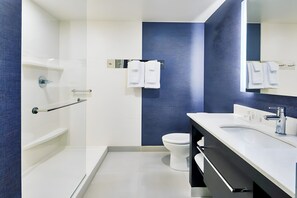 A modern bathroom with a white sink, a mirror, and a toilet. - Residence Inn by Marriott New Haven Hamden (Hamden)