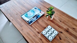 Guests can enjoy browsing through a selection of travel and lifestyle magazines at this stylish table setting.