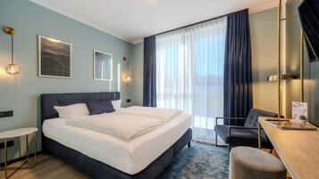 Desk, laptop workspace, blackout curtains, free WiFi