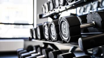 A rack of dumbbells in a gym.