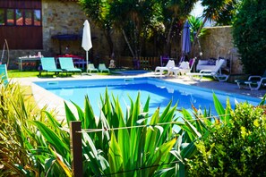 Seasonal outdoor pool, pool umbrellas, pool loungers